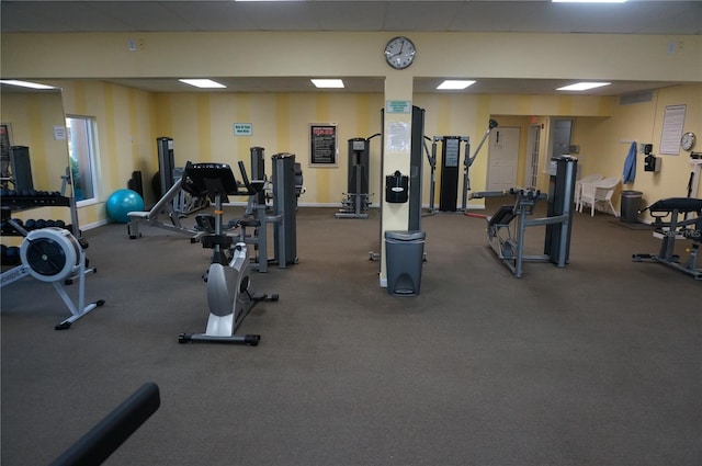exercise room with baseboards