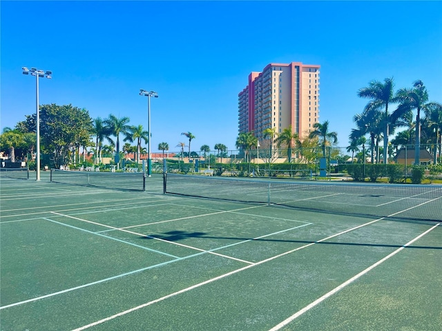 view of tennis court with fence