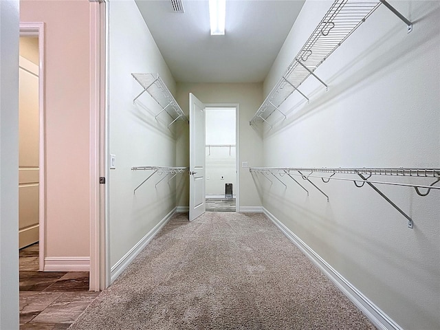 spacious closet featuring visible vents