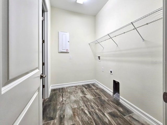 laundry room featuring laundry area, washer hookup, baseboards, electric dryer hookup, and dark wood-type flooring