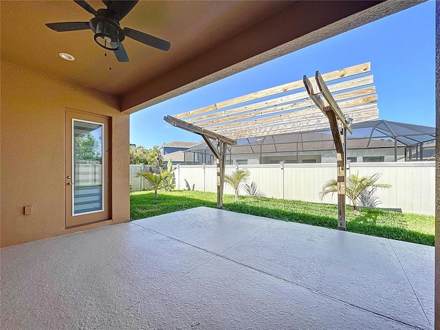 view of patio / terrace featuring a fenced backyard, a ceiling fan, and a pergola