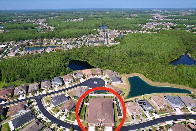 birds eye view of property with a water view and a residential view