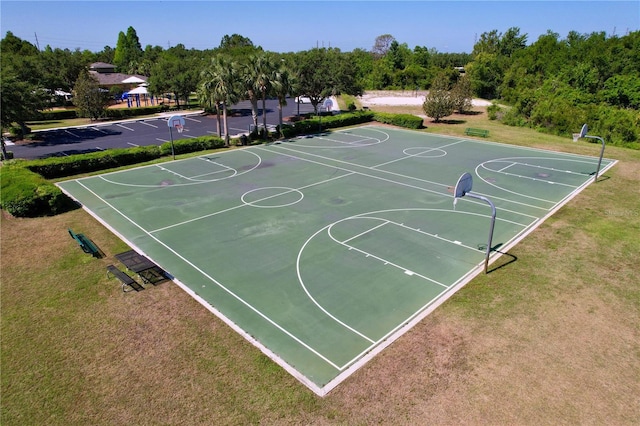 view of basketball court featuring a lawn and community basketball court