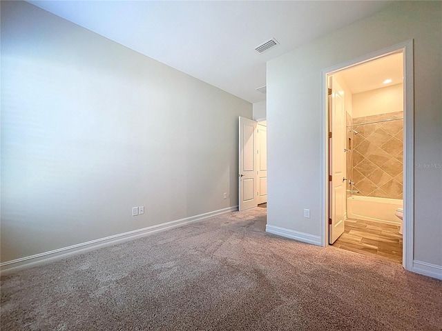 1723 Whitewillow Dr, Wesley Chapel, FL 33543 - unfurnished bedroom featuring carpet, baseboards, and ensuite bathroom