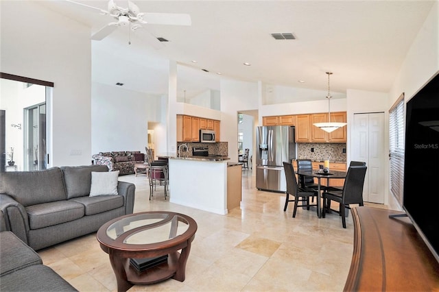 3023 Bent Creek Dr, Valrico, FL 33596 - living room with high vaulted ceiling, ceiling fan, and recessed lighting