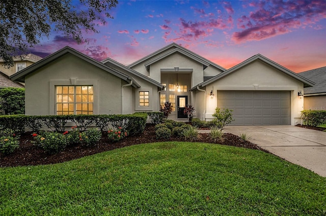 3023 Bent Creek Dr, Valrico, FL 33596 - view of front of home with stucco siding, an attached garage, concrete driveway, and a front yard