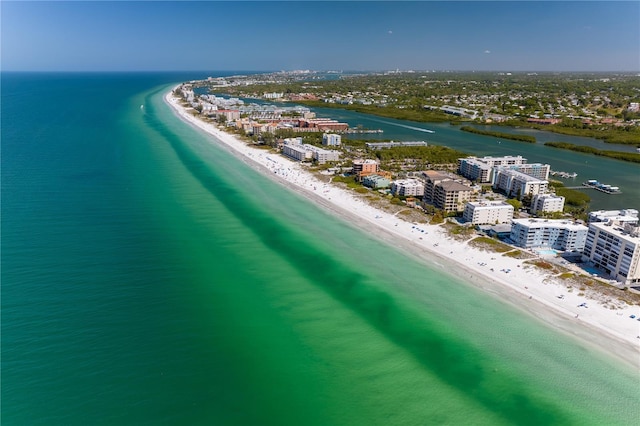 birds eye view of property featuring a water view and a view of the beach