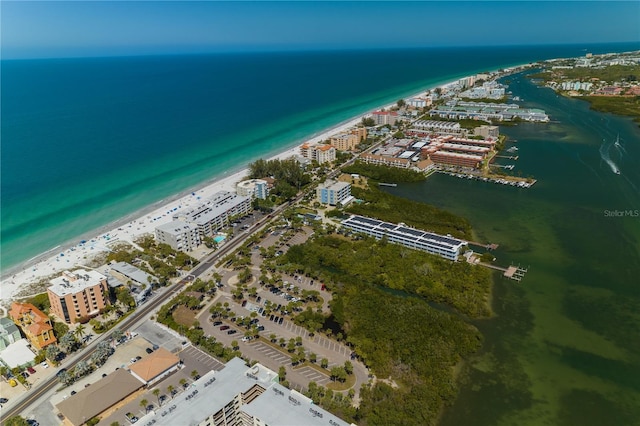 birds eye view of property with a view of the beach and a water view