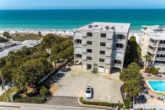 bird's eye view featuring a water view and a view of the beach