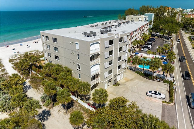 bird's eye view with a water view and a view of the beach