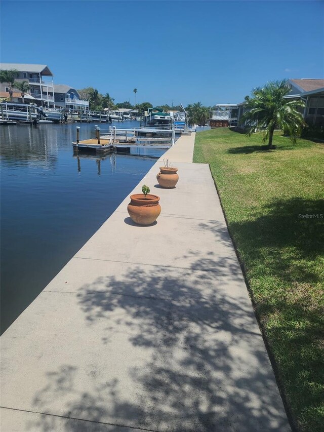 5105 Bonito Dr, New Port Richey, FL 34652 - view of dock featuring a water view and a yard