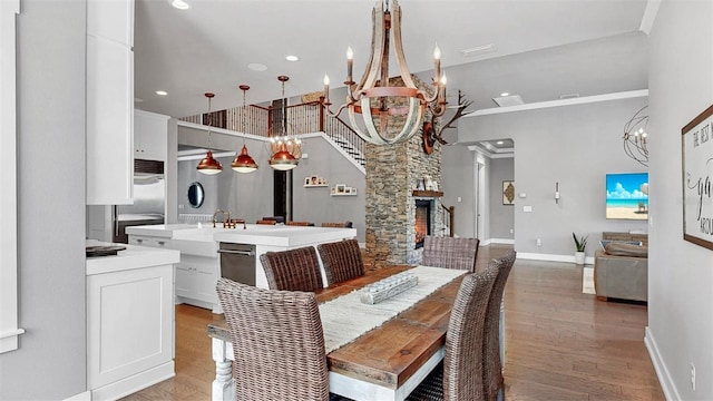 dining area featuring recessed lighting, light wood finished floors, baseboards, and a chandelier