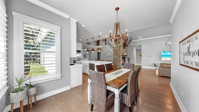 dining space featuring an inviting chandelier, recessed lighting, baseboards, and wood finished floors