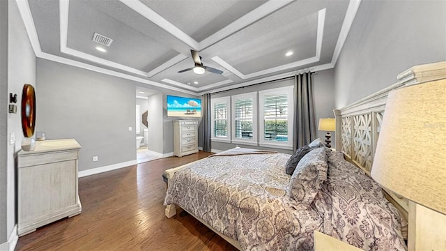 bedroom featuring a ceiling fan, visible vents, wood finished floors, baseboards, and coffered ceiling