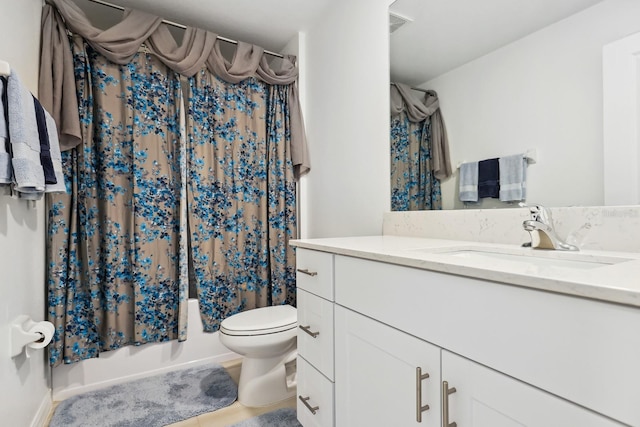 bathroom with toilet, vanity, and shower / bath combo with shower curtain