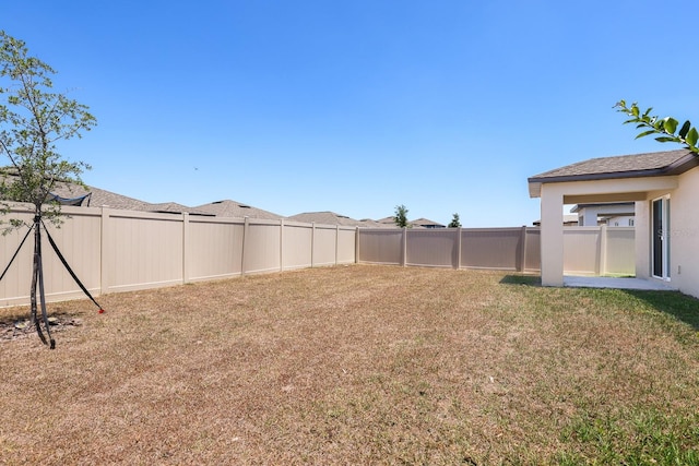 view of yard featuring a fenced backyard