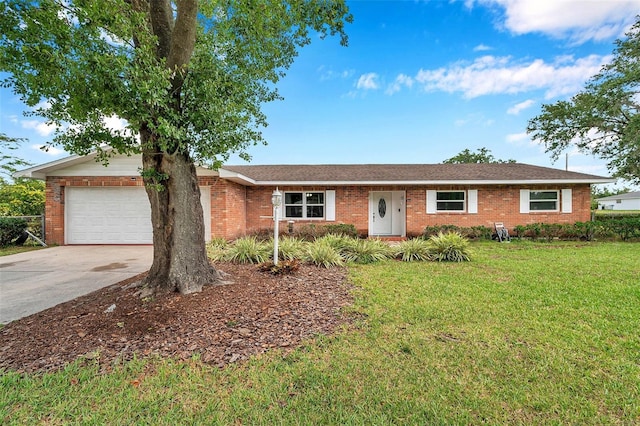 424 Forest Glen Ave, Lakeland, FL 33813 - ranch-style home with brick siding, driveway, an attached garage, and a front lawn