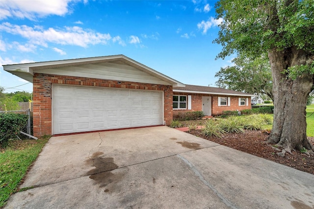 424 Forest Glen Ave, Lakeland, FL 33813 - single story home featuring brick siding, a garage, and concrete driveway