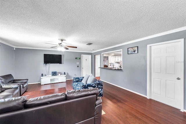 424 Forest Glen Ave, Lakeland, FL 33813 - living area featuring wood finished floors, crown molding, ceiling fan, baseboards, and a textured ceiling