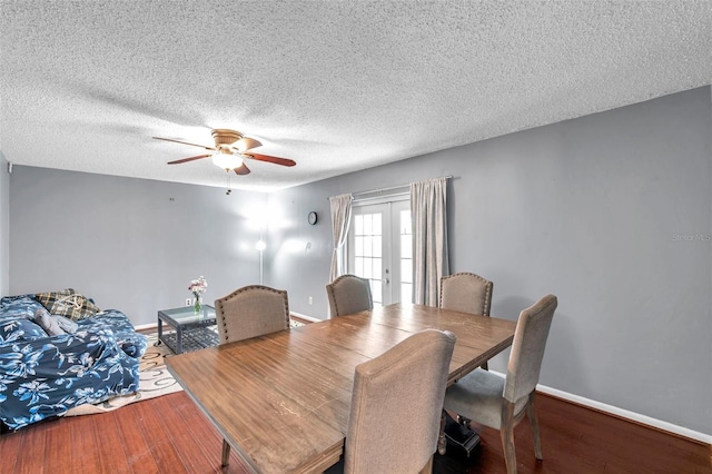 424 Forest Glen Ave, Lakeland, FL 33813 - dining area with wood finished floors, ceiling fan, baseboards, and a textured ceiling