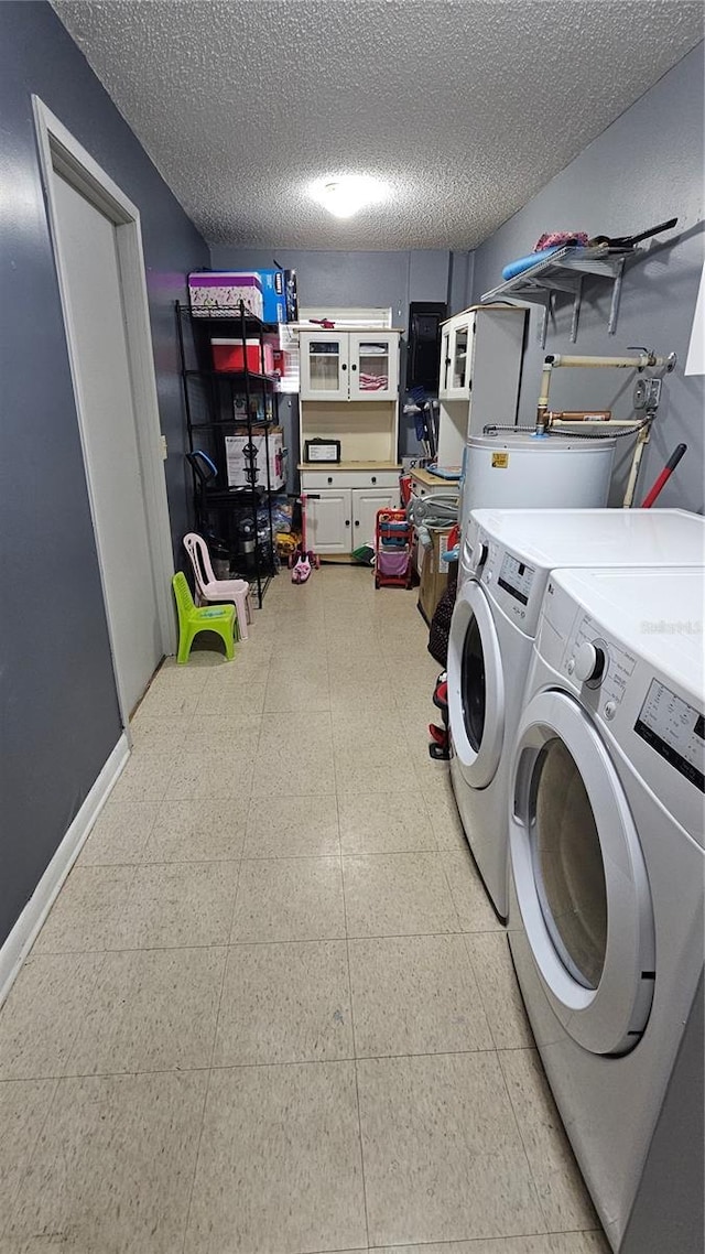 424 Forest Glen Ave, Lakeland, FL 33813 - laundry room featuring separate washer and dryer, light floors, a textured ceiling, and baseboards