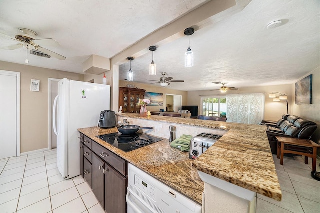 kitchen featuring freestanding refrigerator, black electric cooktop, open floor plan, and a ceiling fan