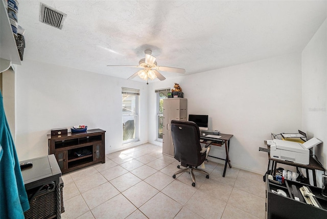 office with light tile patterned floors, ceiling fan, and visible vents