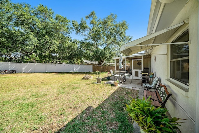 view of yard with a fenced backyard and a patio area