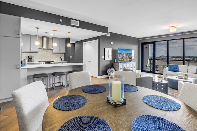199 Dali Blvd Unit 902, Saint Petersburg, FL 33701 - dining room with light wood-style flooring and baseboards