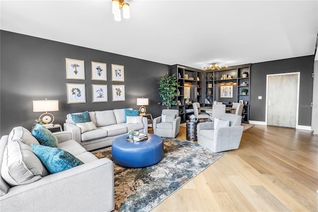 199 Dali Blvd Unit 902, Saint Petersburg, FL 33701 - living area featuring wood finished floors, a chandelier, and baseboards