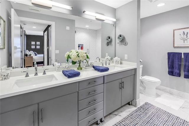 199 Dali Blvd Unit 902, Saint Petersburg, FL 33701 - ensuite bathroom featuring marble finish flooring, a shower stall, toilet, double vanity, and recessed lighting