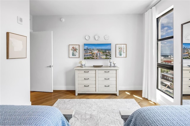 199 Dali Blvd Unit 902, Saint Petersburg, FL 33701 - bedroom featuring baseboards and light wood finished floors