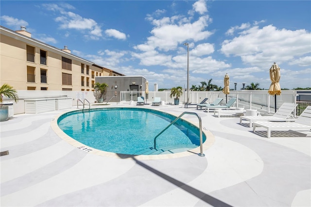 199 Dali Blvd Unit 902, Saint Petersburg, FL 33701 - community pool featuring a patio area and fence