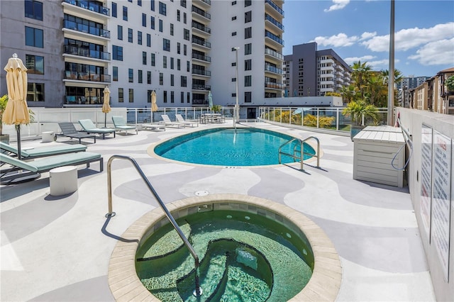199 Dali Blvd Unit 902, Saint Petersburg, FL 33701 - community pool with a hot tub, a patio, and fence
