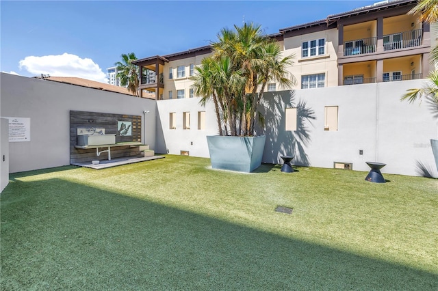 199 Dali Blvd Unit 902, Saint Petersburg, FL 33701 - back of house with stucco siding and a yard