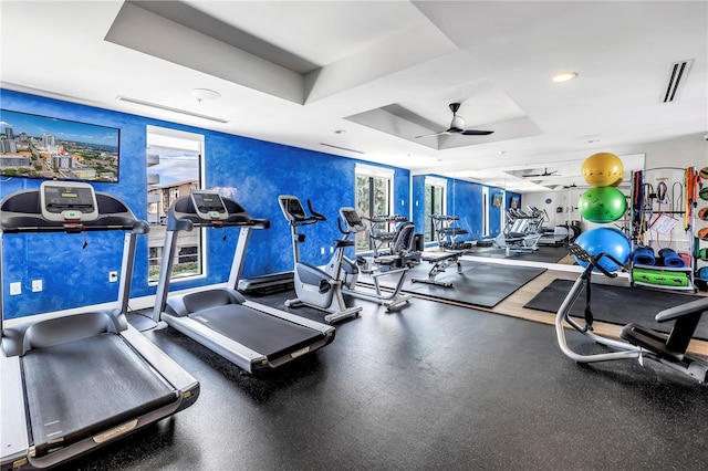 199 Dali Blvd Unit 902, Saint Petersburg, FL 33701 - gym featuring a tray ceiling and a ceiling fan