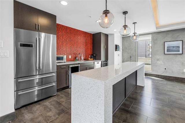 199 Dali Blvd Unit 902, Saint Petersburg, FL 33701 - kitchen with freestanding refrigerator, a sink, recessed lighting, a center island, and decorative light fixtures