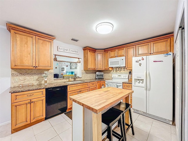 3078 Pointer Dr, Palm Harbor, FL 34683 - kitchen with visible vents, white appliances, butcher block countertops, tasteful backsplash, and a sink