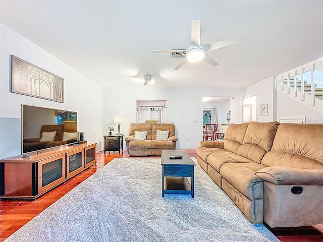 3078 Pointer Dr, Palm Harbor, FL 34683 - living room featuring baseboards, ceiling fan, wood finished floors, and stairway