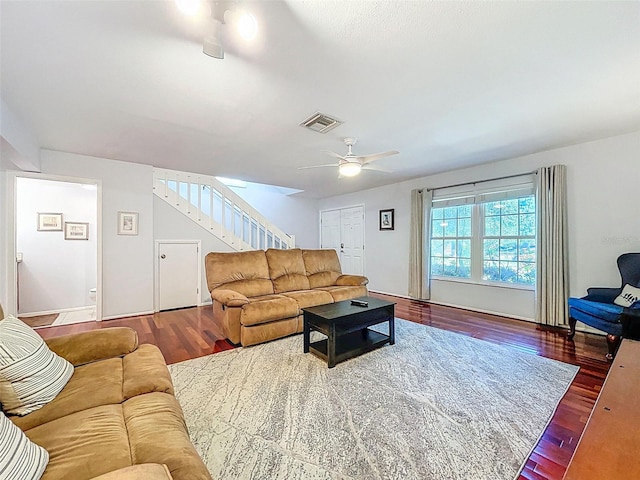 3078 Pointer Dr, Palm Harbor, FL 34683 - living area with stairway, ceiling fan, wood finished floors, and visible vents