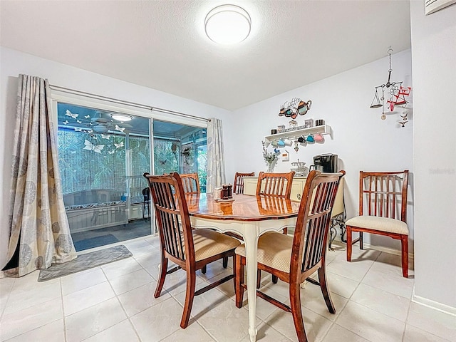 3078 Pointer Dr, Palm Harbor, FL 34683 - dining space with light tile patterned floors, baseboards, and a wall mounted AC