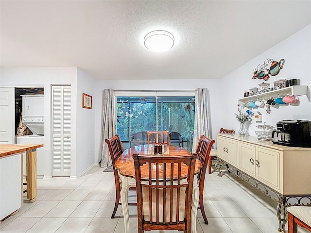 3078 Pointer Dr, Palm Harbor, FL 34683 - dining room featuring a textured ceiling and light tile patterned floors