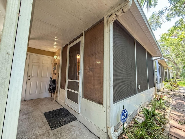 3078 Pointer Dr, Palm Harbor, FL 34683 - view of side of home with crawl space and a sunroom