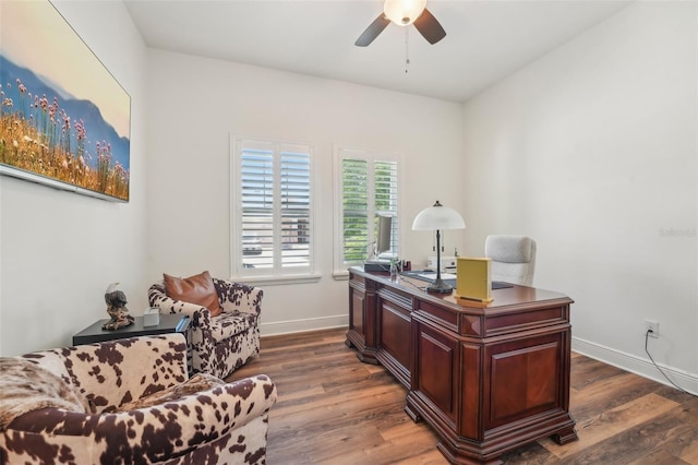office space featuring ceiling fan, dark wood-style floors, and baseboards