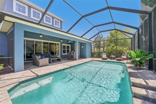 outdoor pool featuring a patio, ceiling fan, a lanai, and an outdoor hangout area