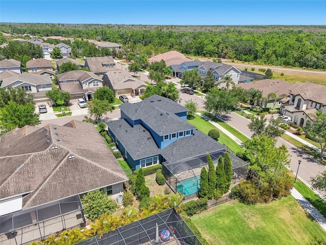 aerial view featuring a residential view and a forest view