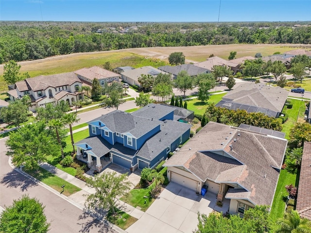 birds eye view of property with a residential view