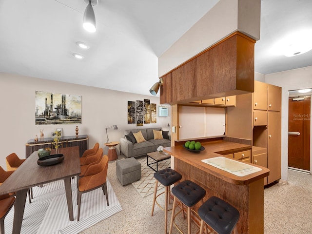 living area with light speckled floor