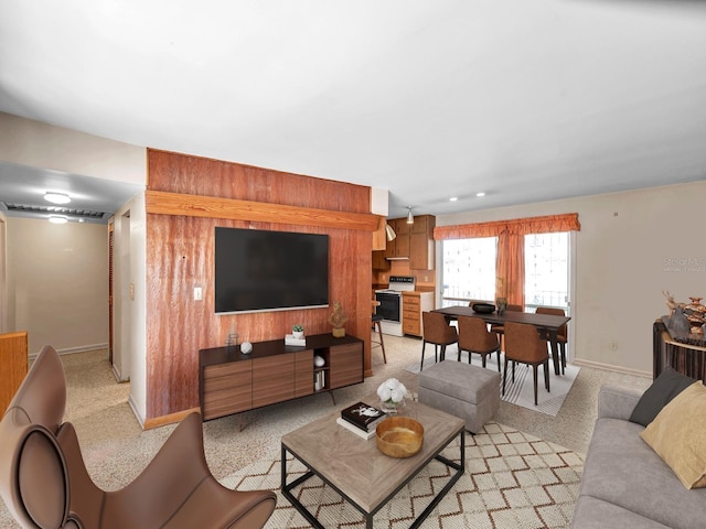living area featuring baseboards