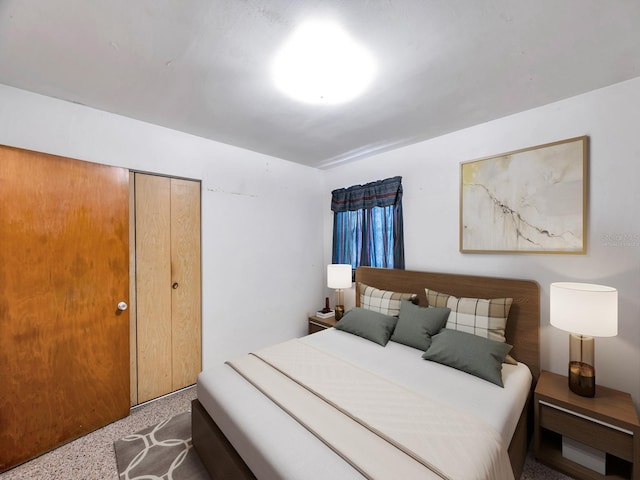 bedroom with a closet and speckled floor